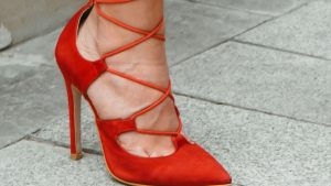 A Woman in Red Leather Peep Toe Heeled Shoes