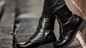 Close-up Shot of a Person Wearing Black Leather Boots