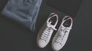 Pair Of White Shoes Beside Pants, Shirt, And Watch