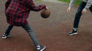 Photograph of People Playing Basketball