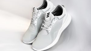 Sneakers with dense surface against gray background