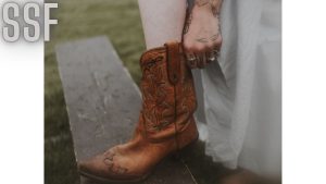 Woman in White Dress Wearing Brown Leather Cowboy Boots